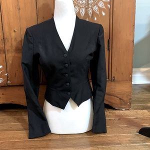 Fitted, lined black court waistcoat jacket.